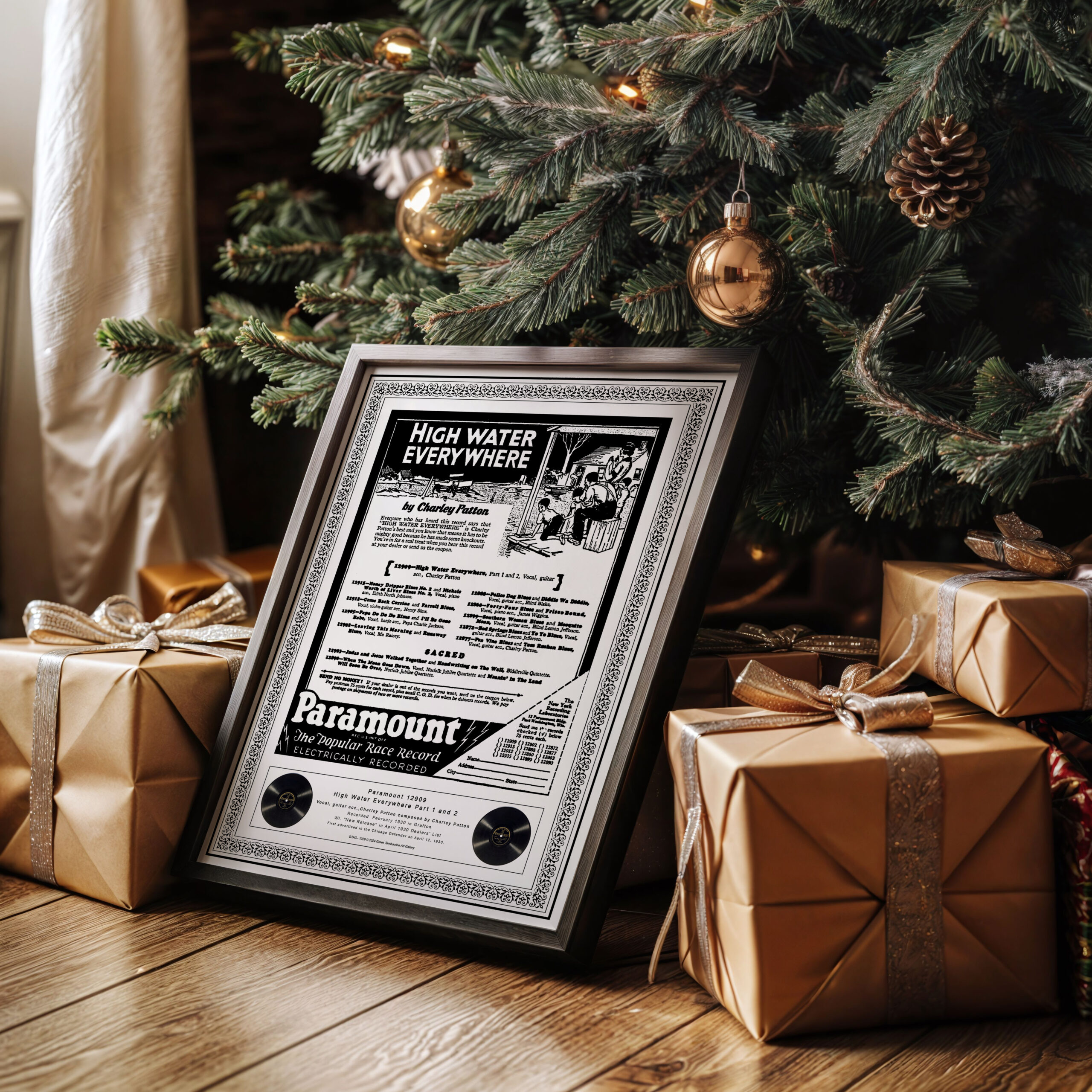 Charley Patton "High Water Everywhere" print framed and displayed under a Christmas tree, surrounded by beautifully wrapped presents.