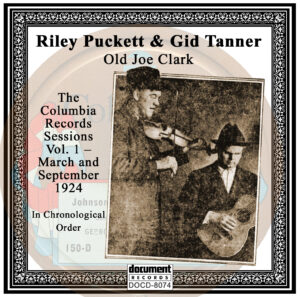 "Front cover of the album DOCD-8074 featuring Gid Tanner and Riley Puckett, titled 'Old Joe Clark: The Columbia Records March and September 1924 Sessions.' Includes a vintage black-and-white photo of Tanner with a fiddle and Puckett with a guitar, framed with an ornate border."