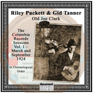 "Front cover of the album DOCD-8074 featuring Gid Tanner and Riley Puckett, titled 'Old Joe Clark: The Columbia Records March and September 1924 Sessions.' Includes a vintage black-and-white photo of Tanner with a fiddle and Puckett with a guitar, framed with an ornate border."