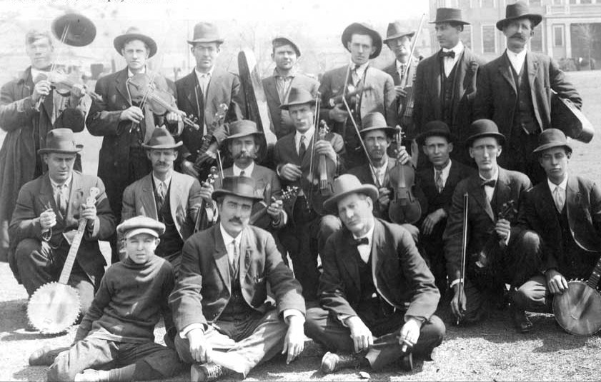 Group photo of fiddlers and banjo players at the 1914 Georgia Old-Time Fiddlers’ Convention, likely including Gid Tanner and Fiddlin’ John Carson in the back row.
