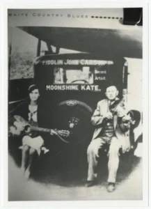 Fiddlin’ John Carson and Moonshine Kate on the Tailboard of a Touring Car